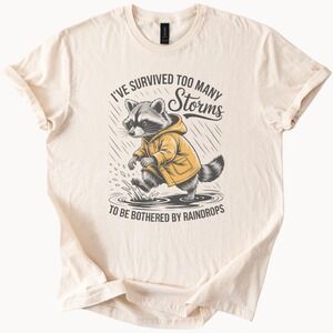 Resilient Raccoon Rainstorm Graphic Tee Natural Cotton Unisex